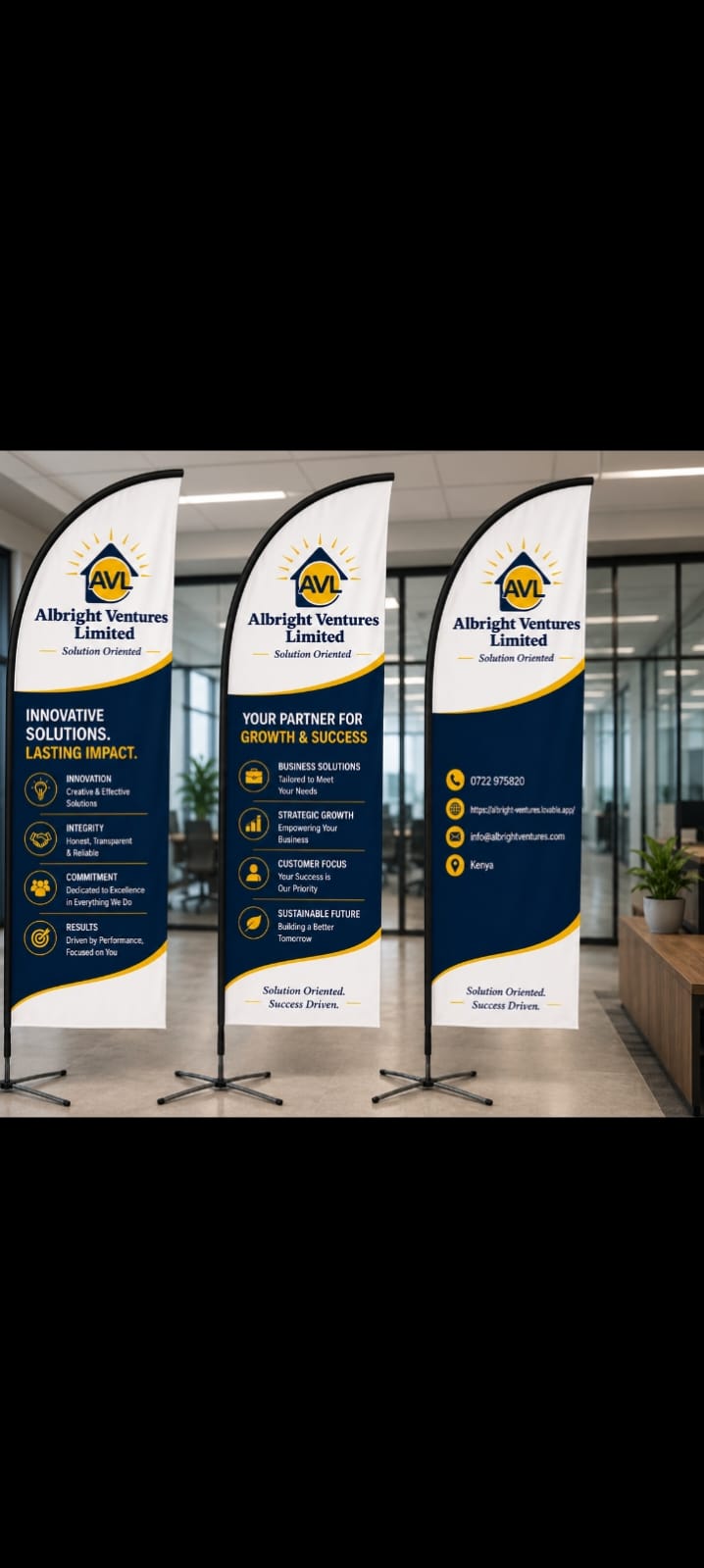AVL branded feather flag banners displayed inside a corporate office